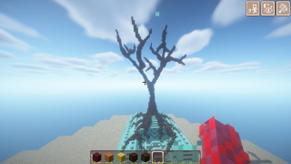 bare tree on an ocean monument